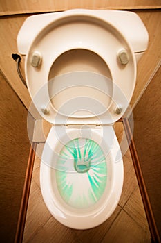 Lavatory pan with cleaner in it