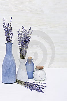 Lavender aromatherapy. Spa background with lavender flowers and essential oil in bottle