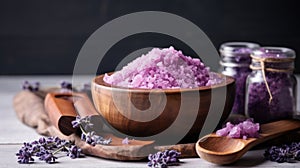 Lavender bath salt in wooden bowl on concrete with copy space, spa relaxation concept