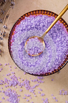 Lavender cooking salt in glass decorative plate with gold teaspoon