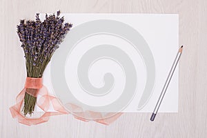 Lavender desk design with flowers on background top view mock up