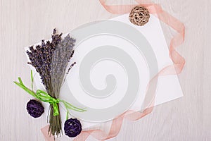 Lavender desk with flowers on background top view mock up.White paper postcard