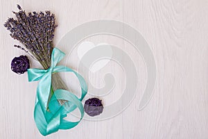 Lavender desk with flowers on background top view mock up.White paper postcard