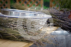 Lavender drying beside bowls on a table