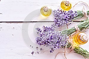 Lavender essential oils with fresh flowers
