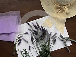 Lavender flower with scissor on wooden table