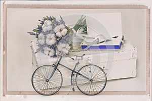 Lavender flowers and Cotton plant on old white suitcase, Mini bike, personal notebook. Vintage postcard style