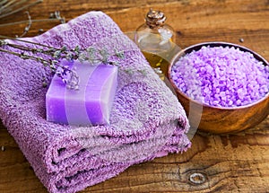 Lavender flowers extract spa soap, oil bottle and bath salt bowl