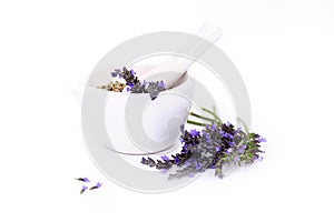 Lavender flowers, lavander extract and montar with dry flowers isolated on white photo