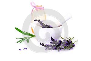 Lavender flowers, lavander oil and montar with dry flowers isolated on white photo