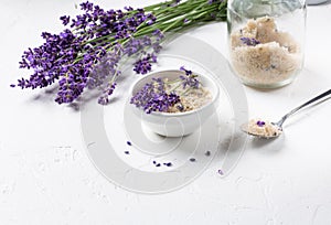 Lavender  infused sugar.  Flower sugar with fresh lavender in white  bowl on white background photo