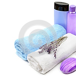 Lavender oil, cream, soap ,Bath towels and dried lavender flowers isolated on a white background