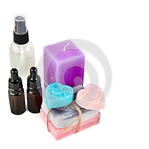Lavender oil, soap and scented candles isolated on white . Free space for text