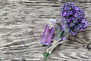 lavender\'s spa products with dried lavender flowers on a wooden table.