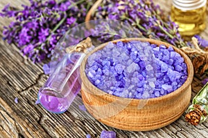 lavender\'s spa products with dried lavender flowers on a wooden table.