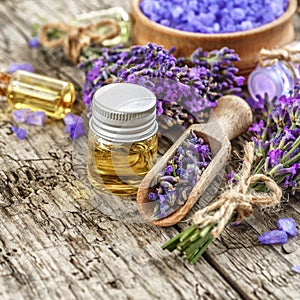 lavender\'s spa products with dried lavender flowers on a wooden table.