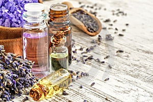 lavender\'s spa products with dried lavender flowers on a wooden table.