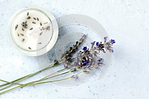 Lavender-scented candle with lavender flowers and a place for text