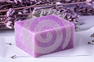 Lavender soap with dried lavender flowers, a close-up