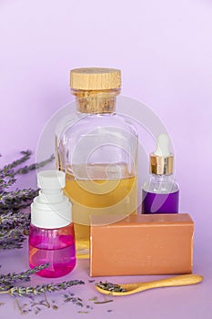 Lavender Soap, Lavande oil, lavander hydrolyte and bouquet on violet background, Homemade cosmetics, Beauty Concept