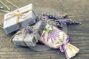 Lavender soap and scented sachets with fresh flowers photo