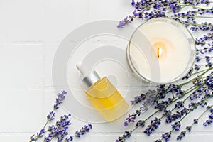 Lavender spa. Lavender natural essential oil, aromatic candle and fresh lavender