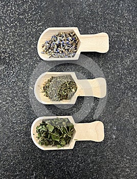 Lavender, thyme and mint on wooden spoons and in bulk. Healthy herbs. Healthy diet