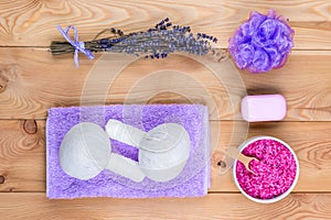 Lavender on wooden planks and cosmetics for massage, relaxation and spa treatments