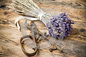 Lavender wooden table beside her scissors.