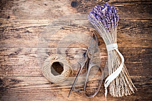 Lavender wooden table beside her scissors.