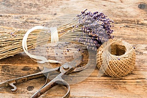 Lavender wooden table beside her scissors.