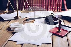 Law act on old wooden desk in library