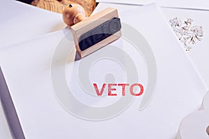 Law act with red veto stamp.