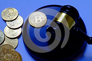 Law or auction concept with gavel and replica of gold bitcoin.Bitcoin cryptocurrency Internet business technology theme