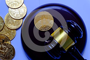 Law or auction concept with gavel and replica of gold bitcoin.Bitcoin cryptocurrency Internet business technology theme