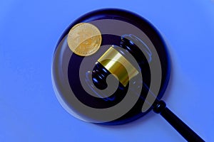 Law or auction concept with gavel and replica of gold bitcoin.Bitcoin cryptocurrency Internet business technology theme