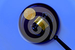 Law or auction concept with gavel and replica of gold bitcoin.Bitcoin cryptocurrency Internet business technology theme.