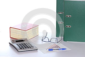 Law book and calculator with documents
