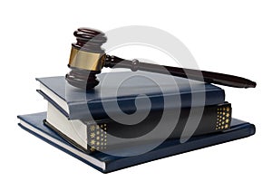 Law book with a wooden judges gavel on table in