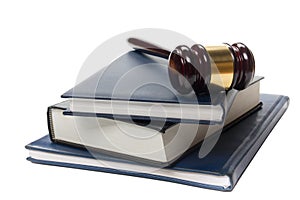 Law book with a wooden judges gavel on table in courtroom