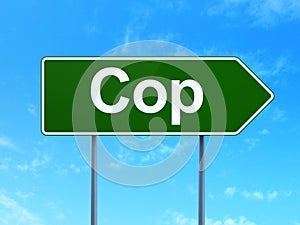 Law concept: Cop on road sign background