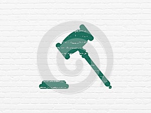 Law concept: Gavel on wall background