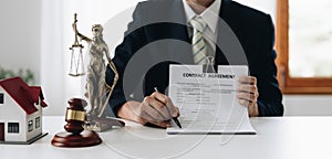 law concept, lawyer woman hoding pen with contract or agreement document to customer for signing in courtroom legal