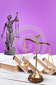 Law concept -Open law book, Judge\'s gavel, scales, Themis statue on table in a courtroom or law enforcement office.