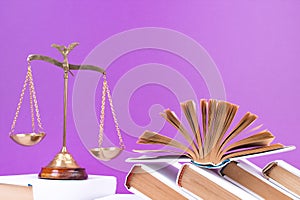 Law concept - Open law book, Judge\'s gavel, scales, Themis statue on table in a courtroom or law enforcement office.