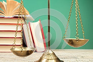 Law concept - Open law book, Judge\'s gavel, scales, Themis statue on table in a courtroom or law enforcement office