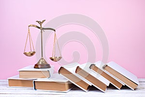 Law concept - Open law book, Judge\'s gavel, scales, Themis statue on table in a courtroom or law enforcement office.