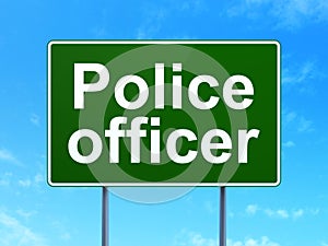 Law concept: Police Officer on road sign background