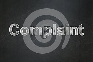 Law concept: Complaint on chalkboard background