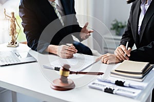 Law, Consultation, Agreement, Contract, Attorney or Lawyer holding a pen is consulting with a client to explain the